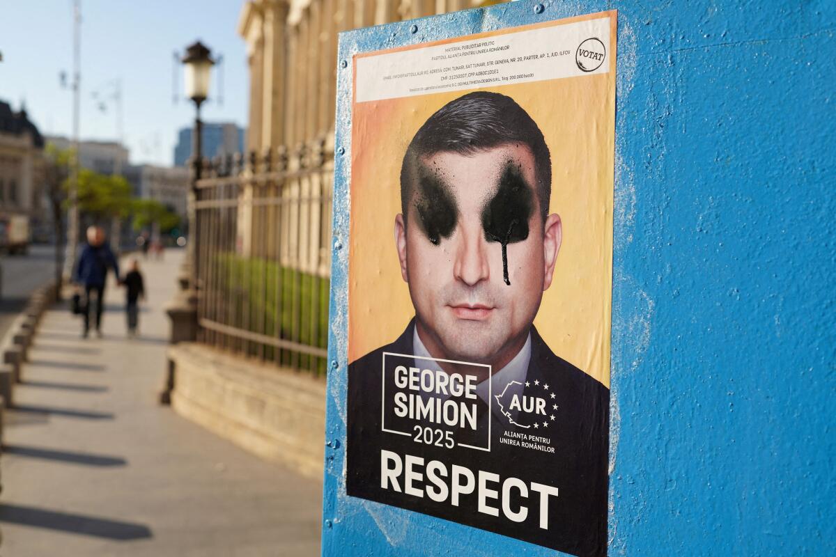 A vandalised electoral poster of George Simion is seen ahead of Romanias presidential elections, in Bucharest, Romania, April 29, 2025
