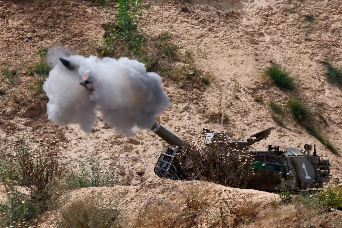 A mobile artillery unit fires towards Gaza, as seen from the Israel, May 6, 2025.
