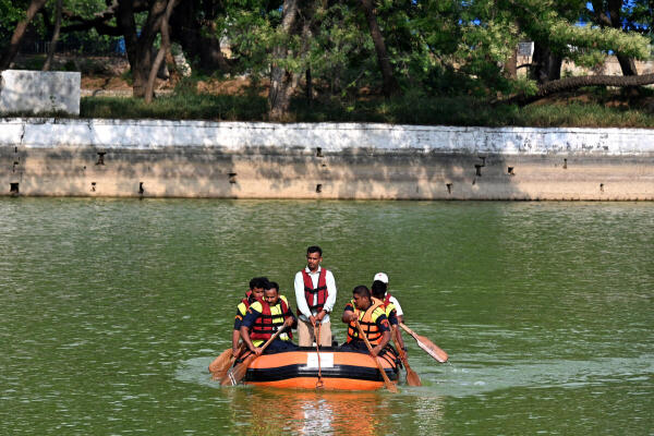 Civil defence and emergency services personnel take part in mock drill 'Operation Abhyaas' at Halasuru lake.