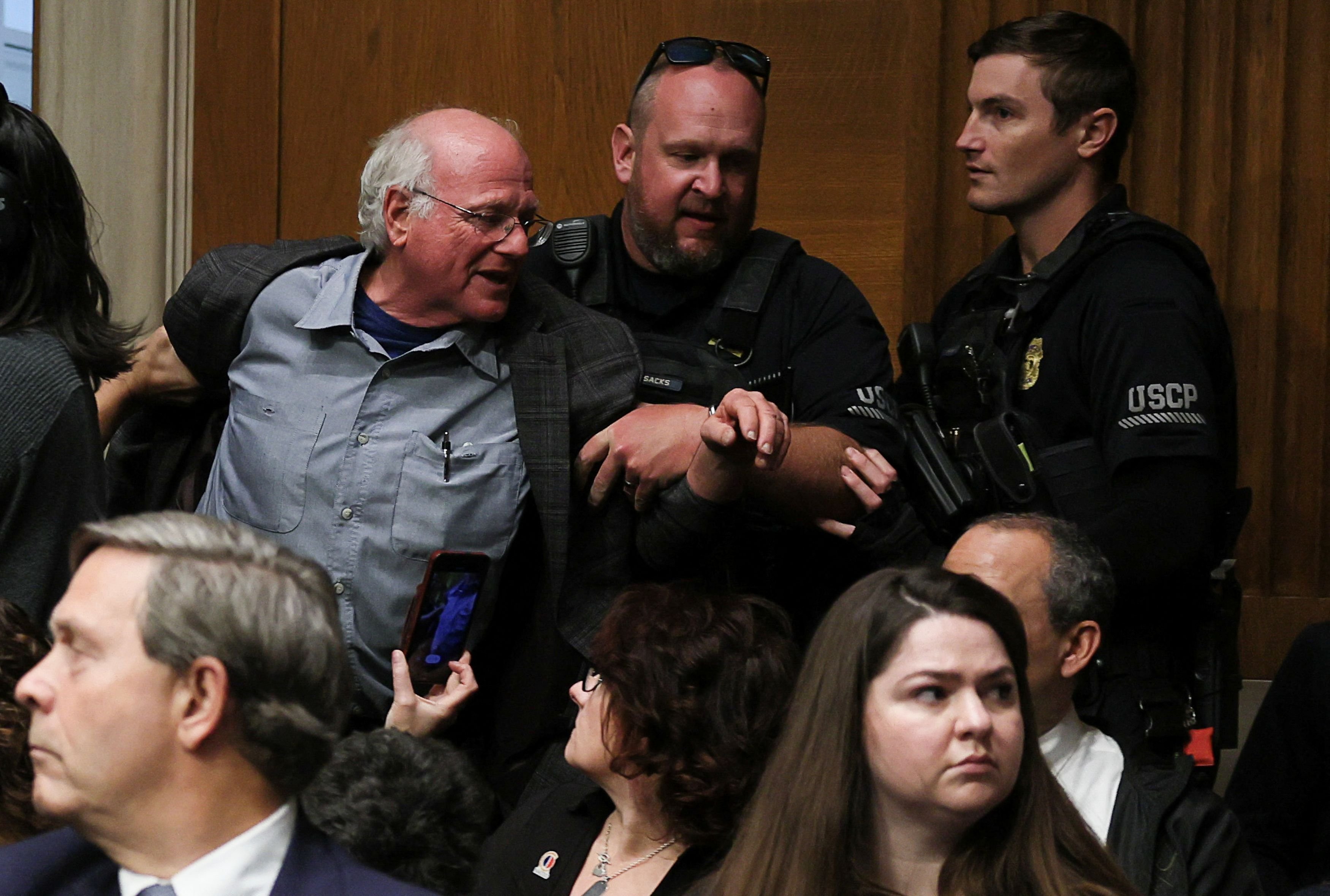 Ben Cohen, co-founder of ice cream company Ben &amp; Jerry’s, is removed by U.S. Capitol Police, as U.S. Health and Human Services  testifies before a Senate Health, Education, Labor &amp; Pensions Committee hearing on the Department of Health and Human Services budget, on Capitol Hill in Washington, D.C., U.S