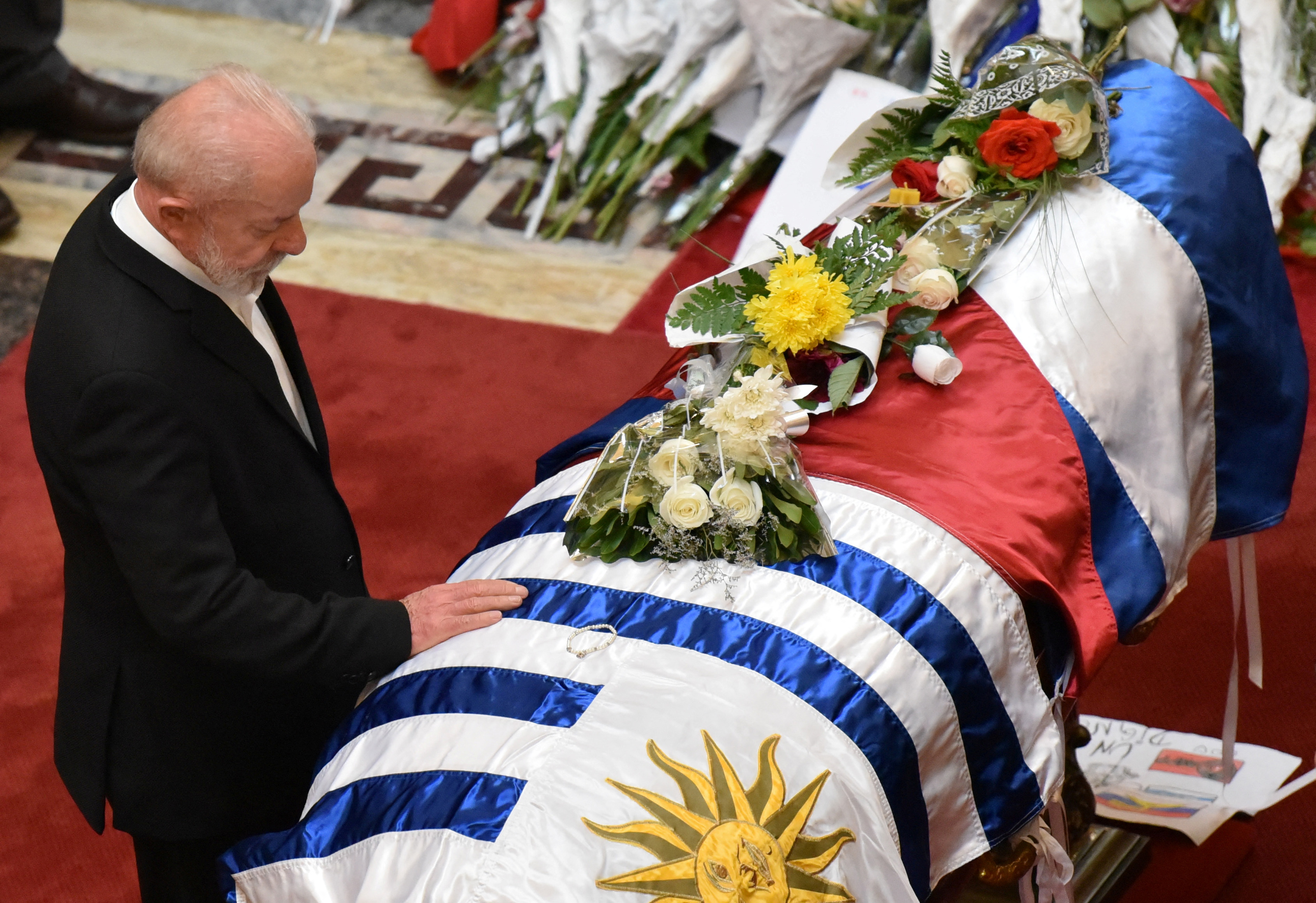 Brazil's President Luiz Inacio Lula da Silva pays his respects to Uruguay's former President Jose "Pepe" Mujica as he lies in state, at Uruguay's Legislative Palace, in Montevideo, Uruguay