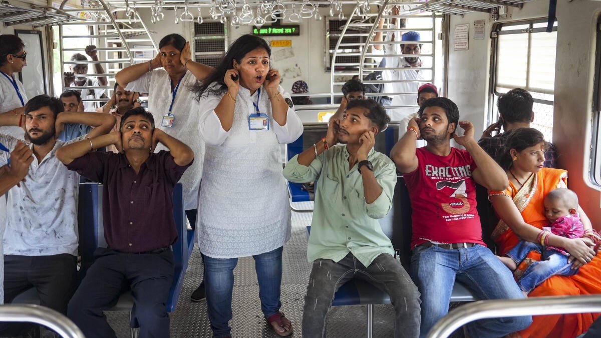 Yoga on train: Mumbai commuters stretch, find calm in chaos