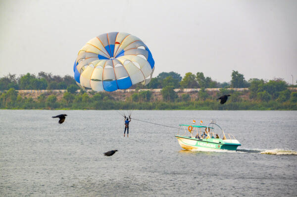 Visitors enjoy parasailing at Ganga Barrage Boat Club, in Kanpur, Uttar Pradesh.