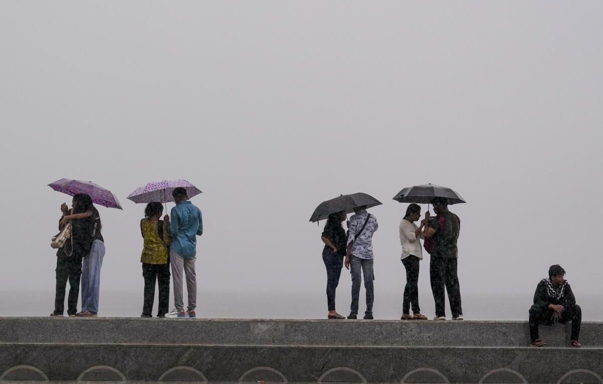 Mumbai: Visitors amid rainfall at Marine Drive, in Mumbai, Maharashtra, Saturday, June 7, 2025.
