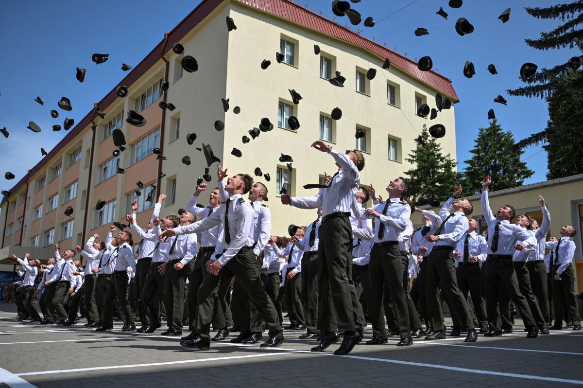 Military cadets of the Lviv lyceum with enhanced military and physical training named after Heroes of Kruty, react after a graduation ceremony, amid Russia's attack on Ukraine, in Lviv, Ukraine June 7, 2025.