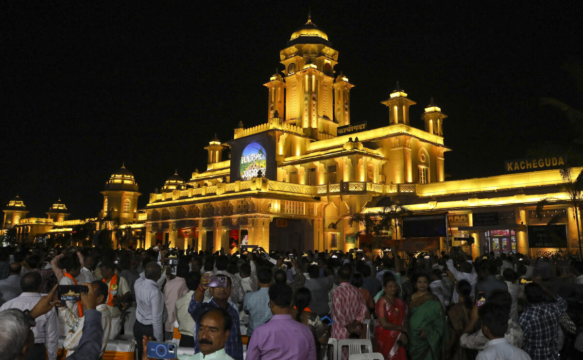 Visitors click pictures during the inauguration of the facade lighting system at Kacheguda railway station by Telangana BJP president and Union minister G. Kishan Reddy, in Hyderabad, Monday, June 9, 2025.