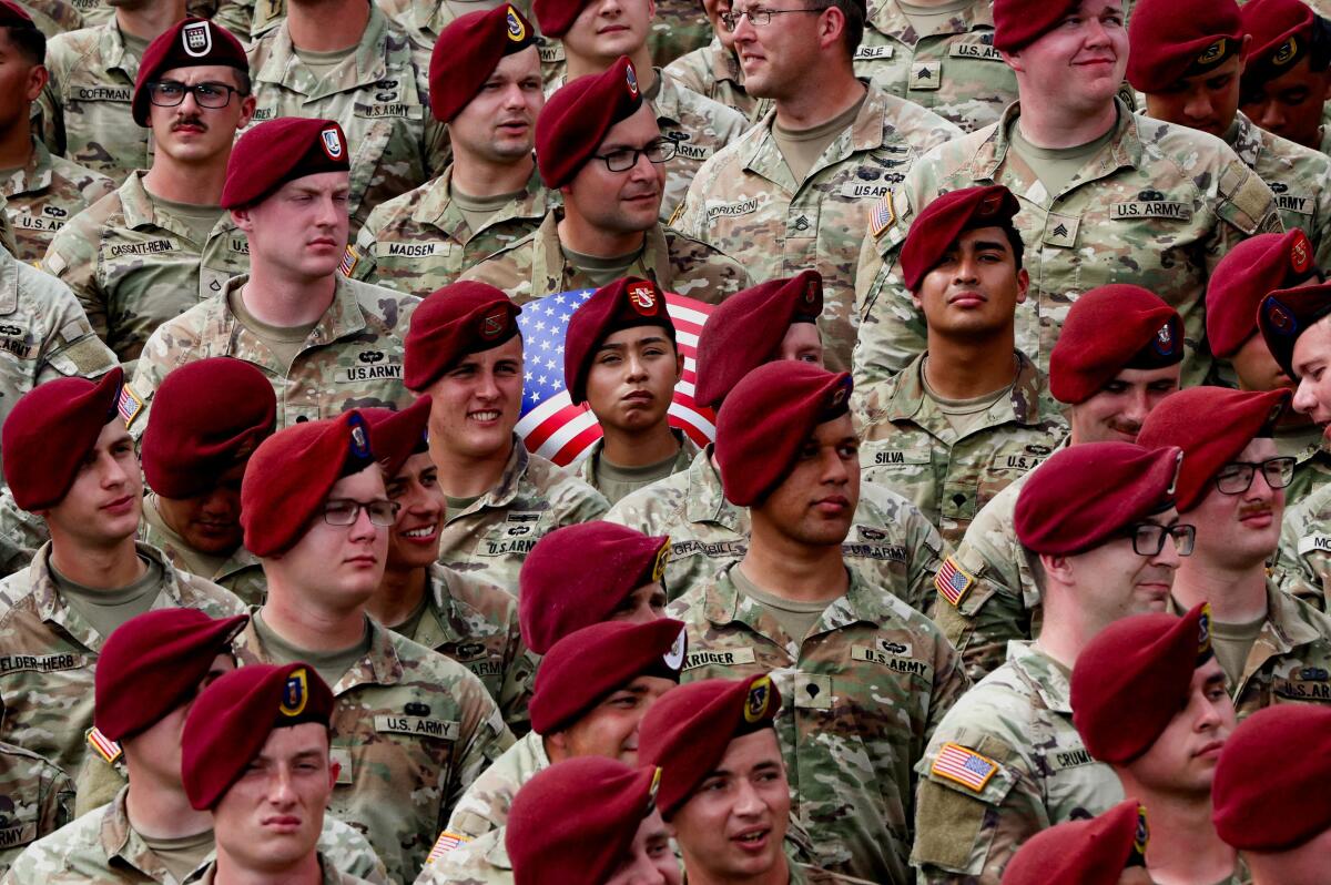 U.S. Army members gather on the day of U.S. President Donald Trump's visit to Fort Bragg to mark the U.S. Army anniversary, in North Carolina, U.S., June 10, 2025.