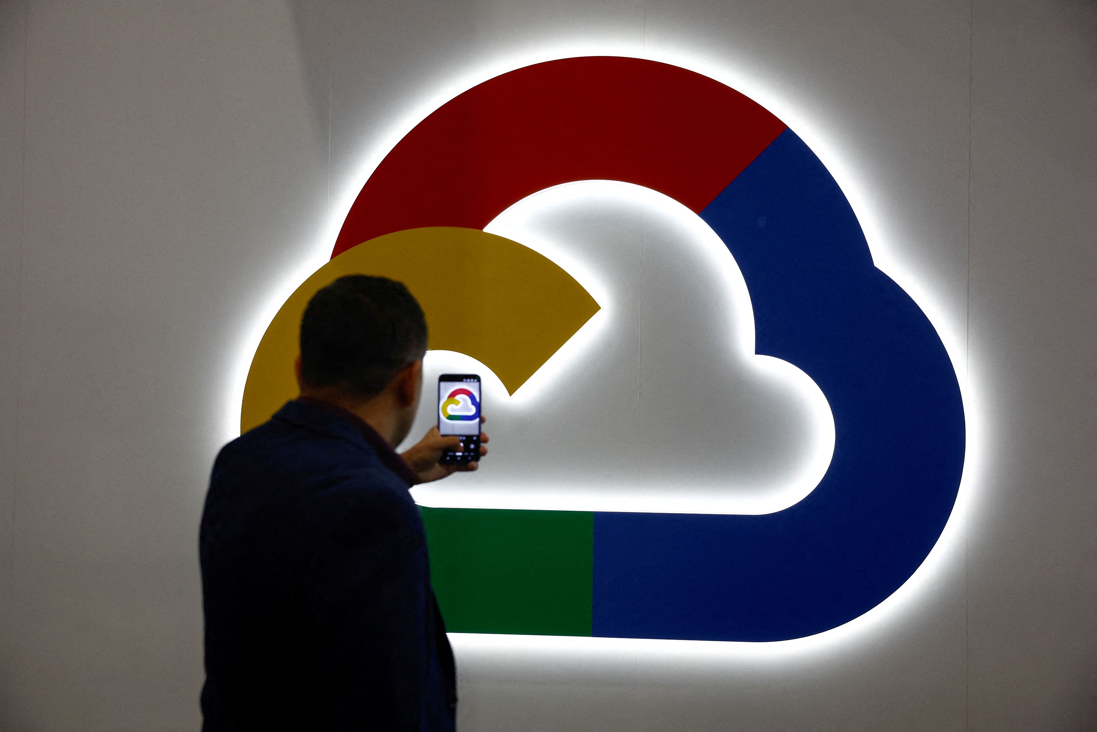 FILE PHOTO: A person takes a photo of the Google Cloud logo, during the 2025 Mobile World Congress  in Barcelona, Spain, March 4, 2025. REUTERS/Albert Gea/File Photo