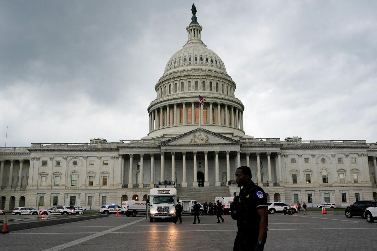Security forces members operate after protesters broke through barrier fencing on Capitol Hill in Washington, DC, US