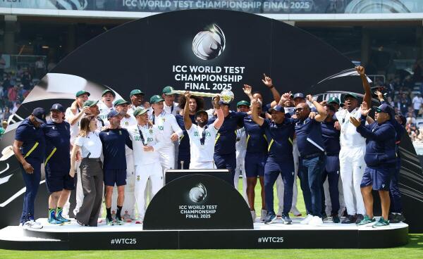 South Africa's Temba Bavuma lifts the ICC Test Championship Mace on the podium with teammates