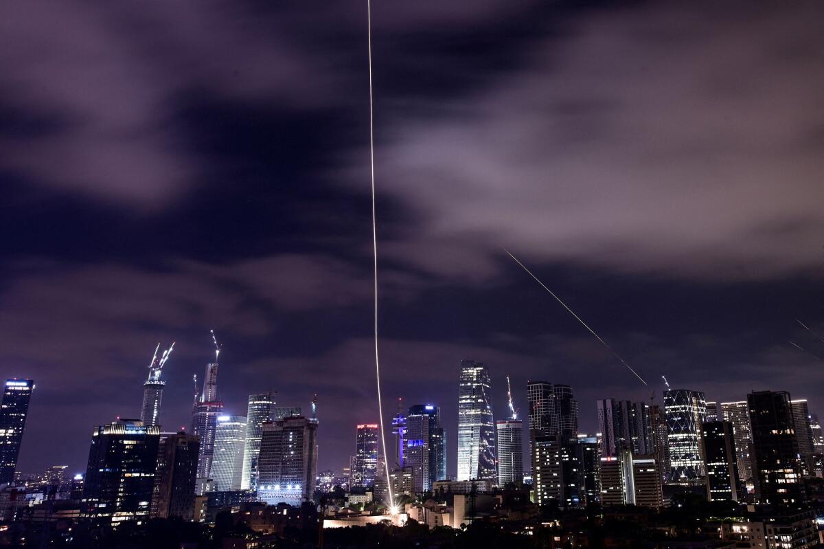 Missiles launched from Iran are intercepted as seen from Tel Aviv, Israel, June 15, 2025. 