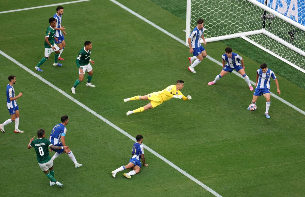 FC Porto's Moura blocks the ball off the line after a shot from Palmeiras' Richard Rios.