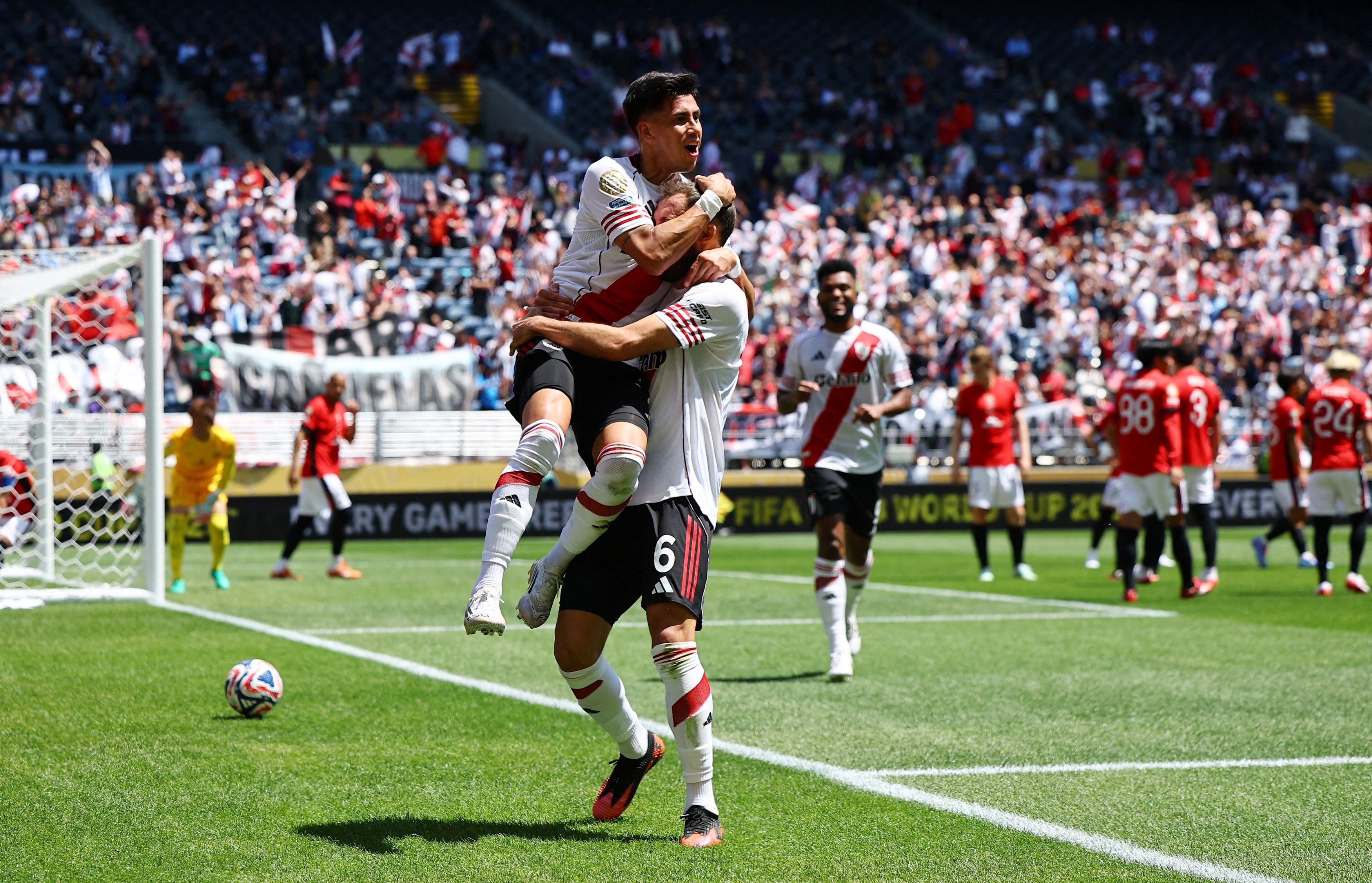 River Plate's Maximiliano Meza celebrates scoring their third goal with German Pezzella.