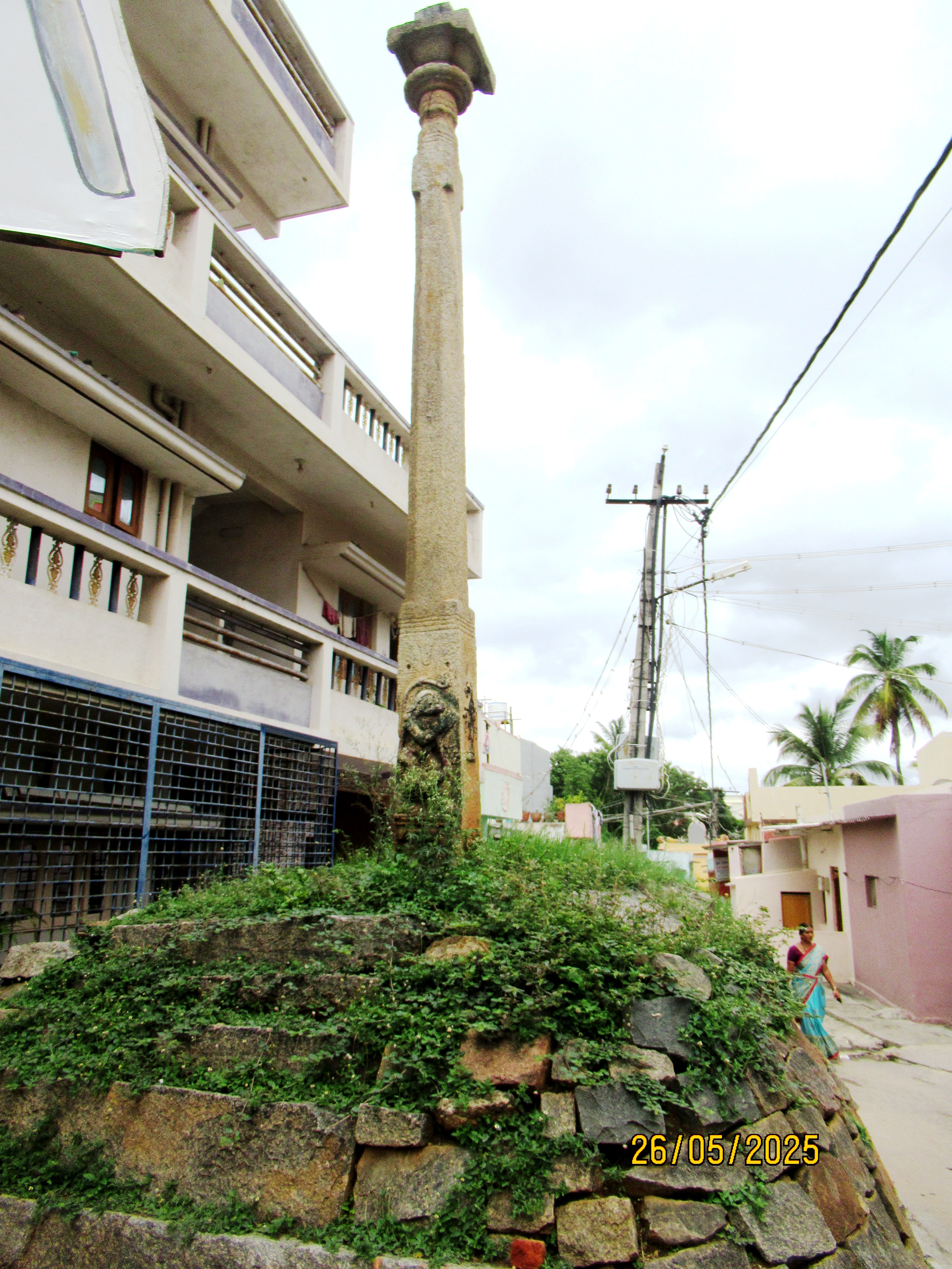 The ancient Garuda pillar in the narrow lane of Dasanapura.