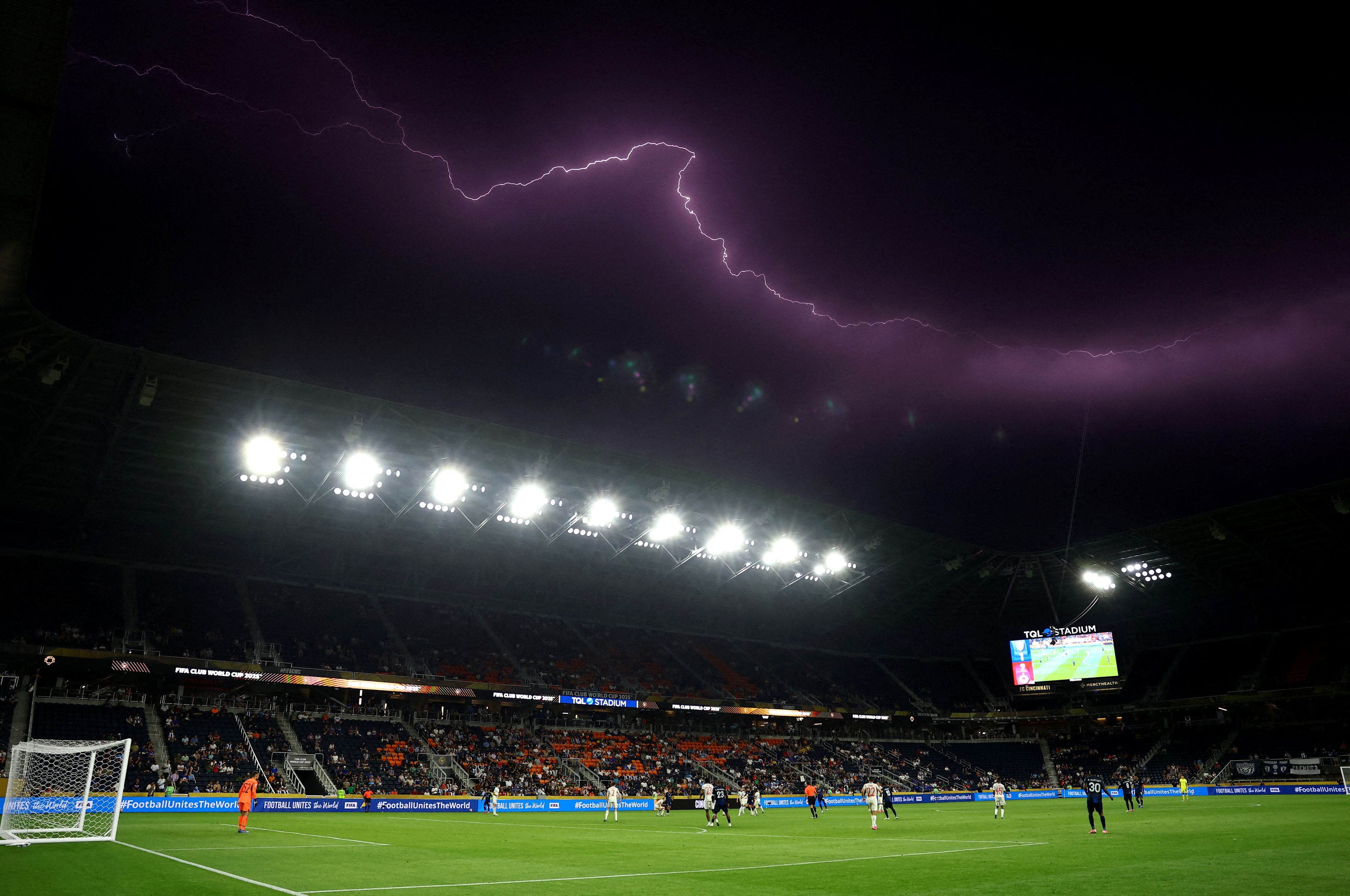 Lightning is seen above the stadium during the Pachuca v RB Salzburg match in Cincinnati, Ohio, June 18, 2025.