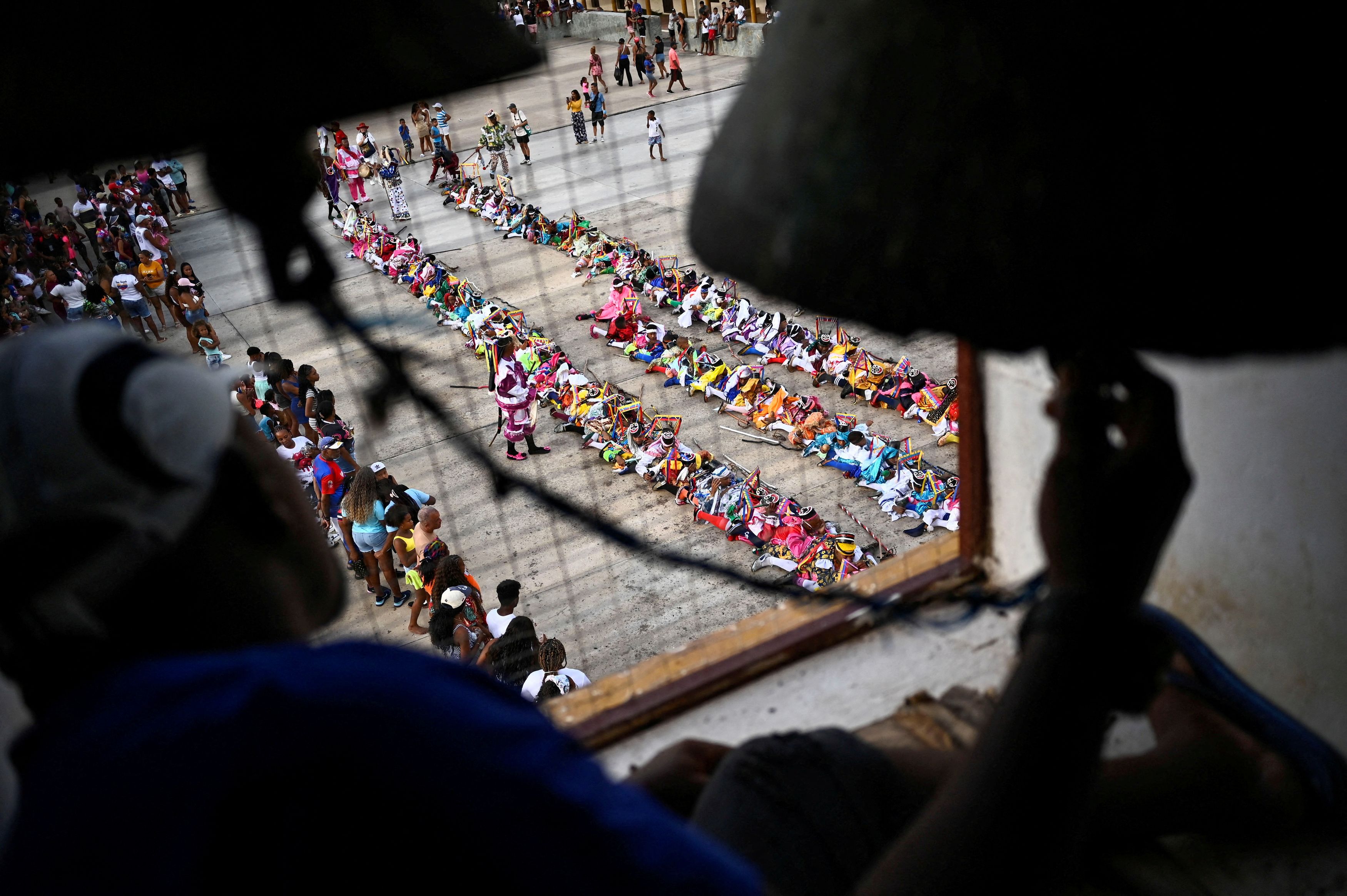 Members of the Brotherhood of the Diablos Danzantes de Chuao (Dancing Devils of Chuao) participate during the Corpus Christi festival in the town of Chuao, Aragua state, Venezuela June 18, 2025.