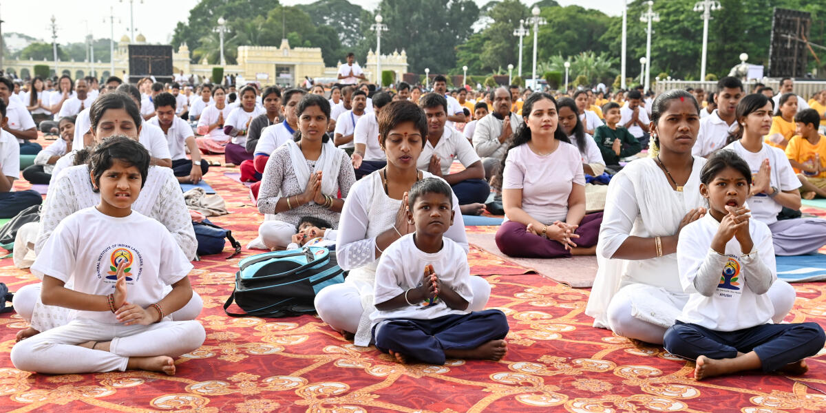 Special children perform at 11th International Yoga day event at Mysuru Palace premises on Saturday morning. 
