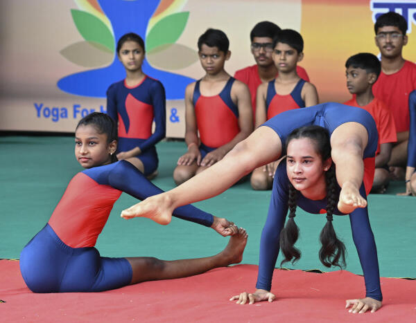Students take part in a yoga session, organised to mark the International Day of Yoga, in Nagpur, Maharashtra.