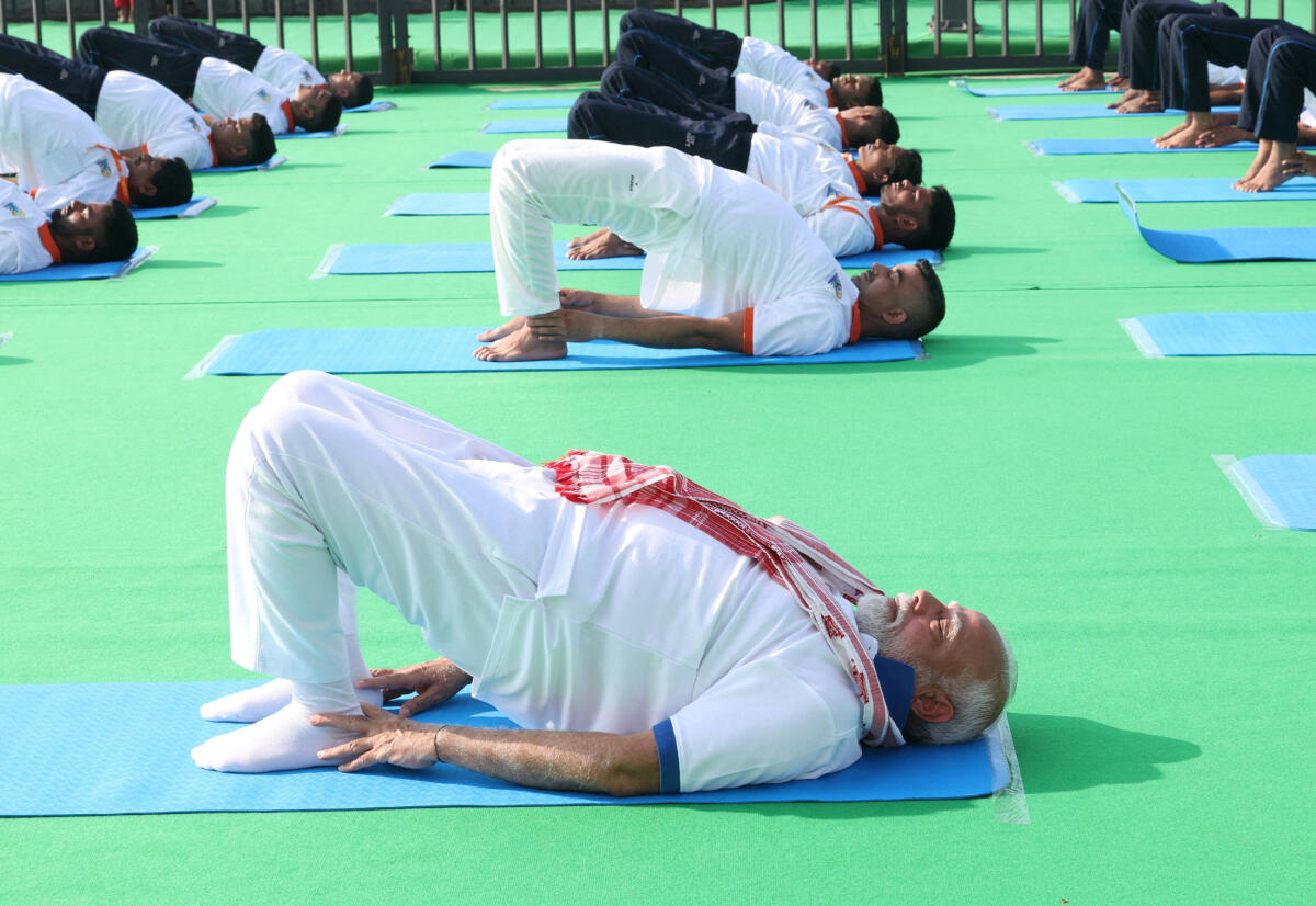 India's Prime Minister Narendra Modi performs yoga on International Yoga Day in Vishakhapatnam.