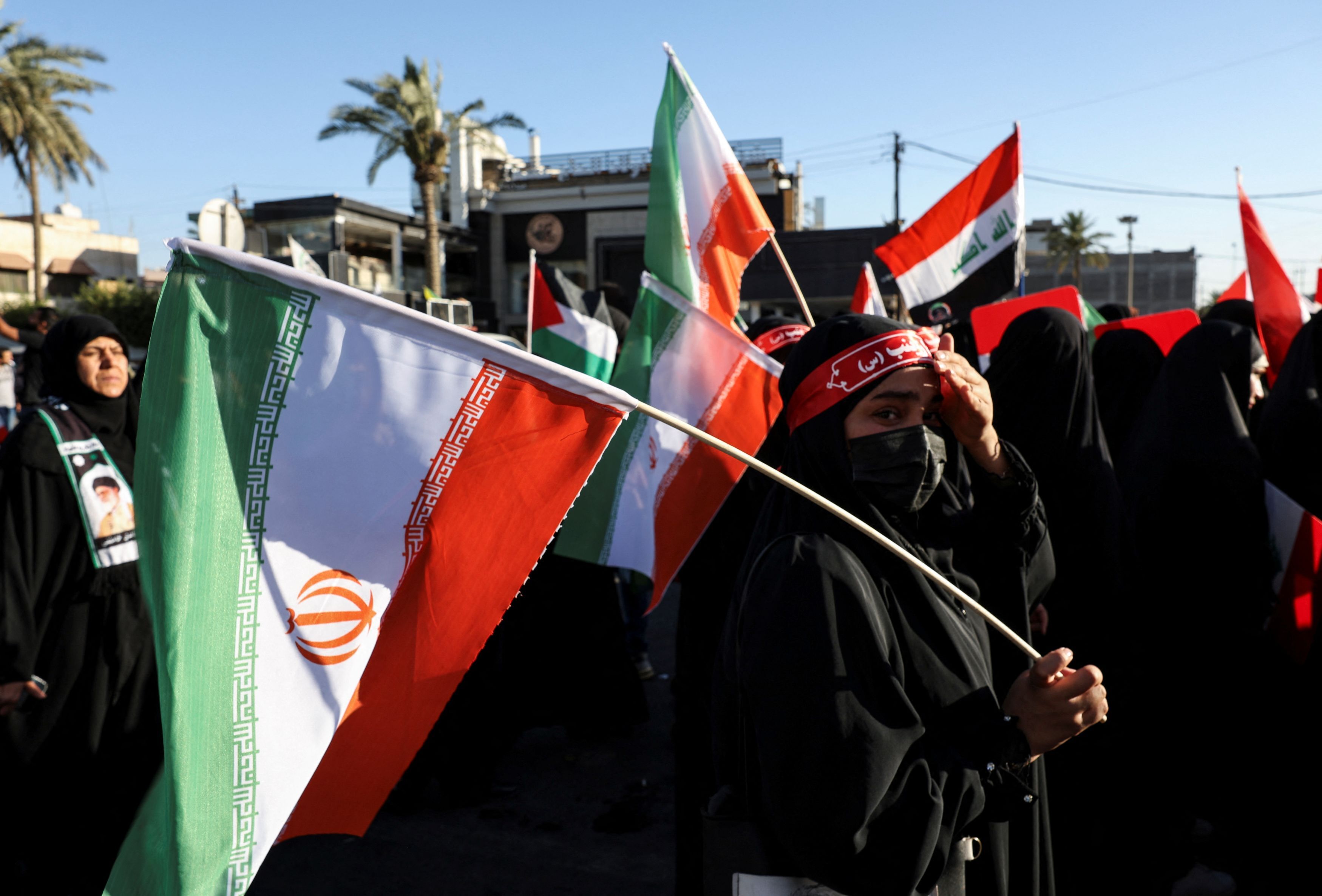 Iraqi people gather during a rally to show solidarity with Iran, amid the Iran-Israel conflict, in the Shi'ite district of Kadhimiya, Baghdad, Iraq, June 21, 2025.