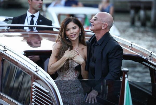 Amazon founder Jeff Bezos and his wife Lauren Sanchez Bezos travel on a boat, as they leave Aman Venice hotel