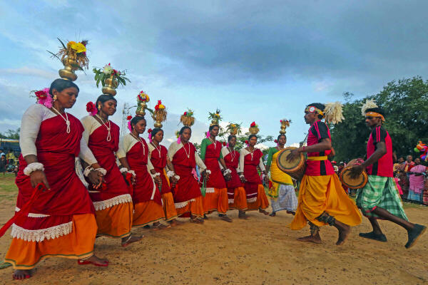 Tribals perform during the celebrations of 'Hul Diwas', organised in remembrance of the Santhal rebellion, on the outskirts of Bolpur, in Birbhum