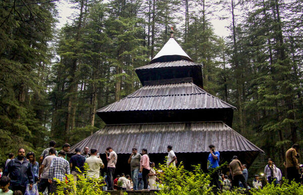 Tourists visit Hadimba Devi Temple at Manali, in Kullu district
