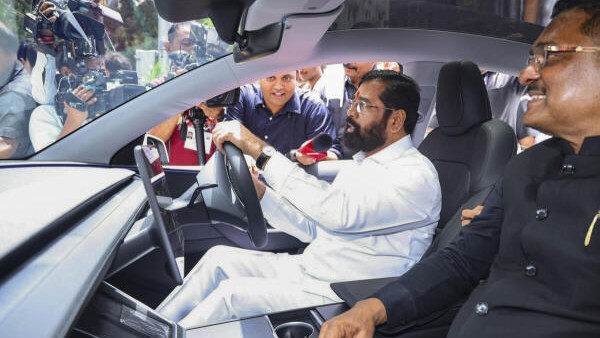 Eknath Shinde test drives a Tesla day after Musk-owned carmaker opens showroom in Mumbai