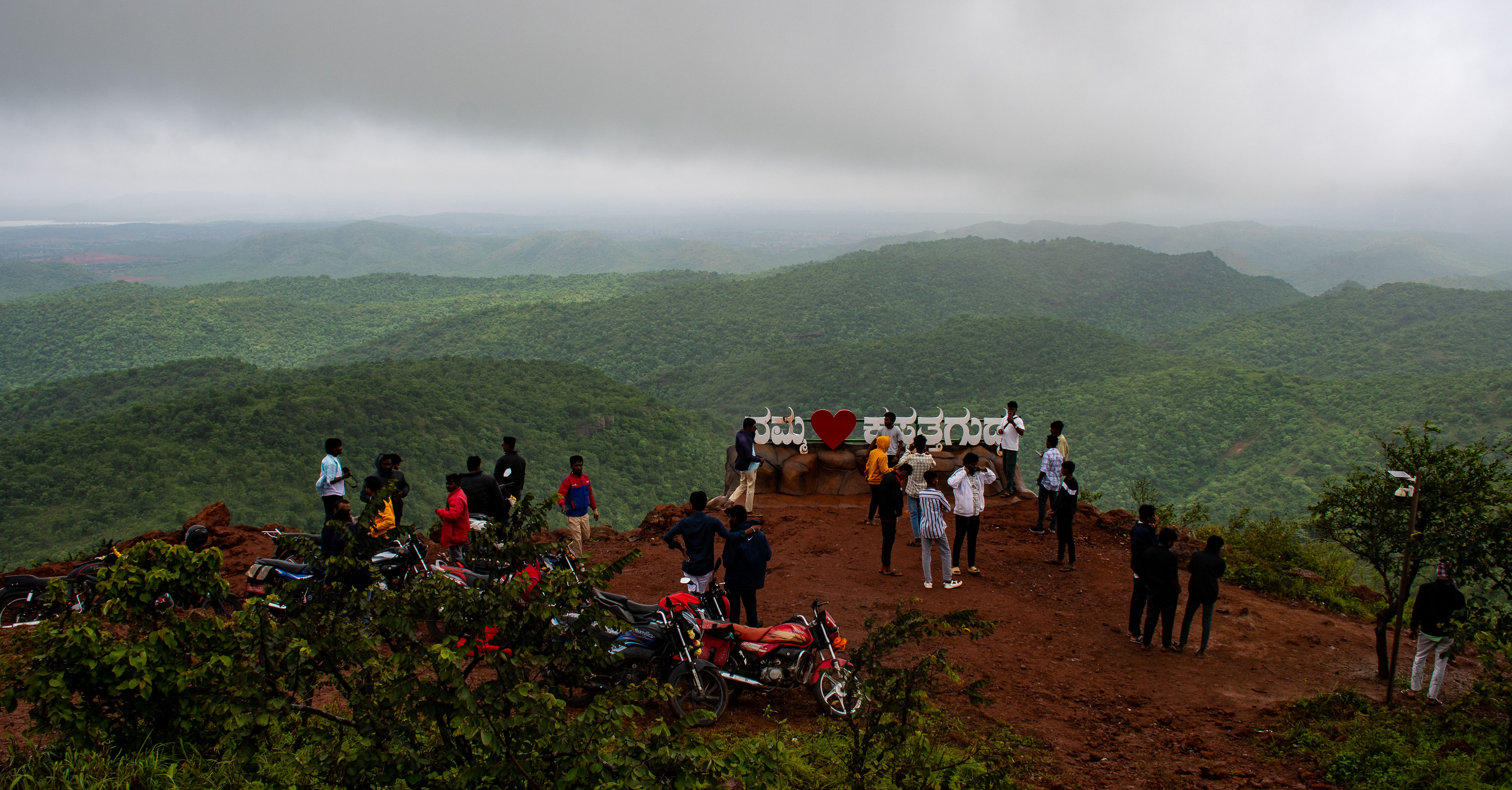 People gather at a viewpoint at Kappatagudda. 