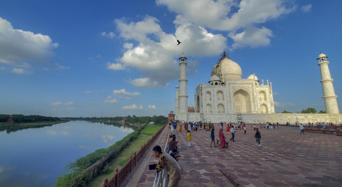 Visitors at the Taj Mahal complex on the banks of the Yamuna river, in Agra