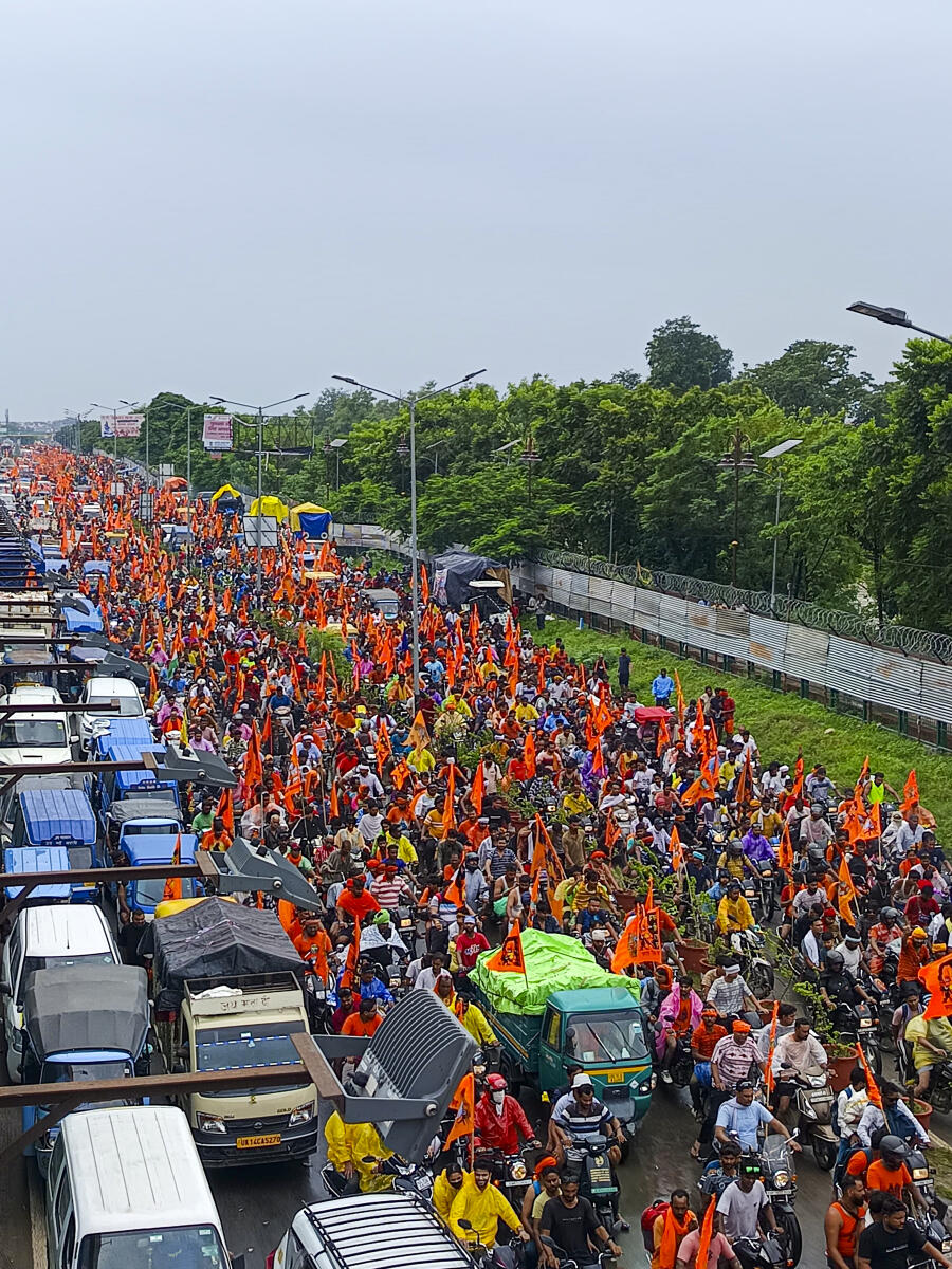 Vehicles stuck in a traffic jam as 'Kanwariyas' move on a road during their pilgrimage in the holy month of 'Shravan', in Haridwar.