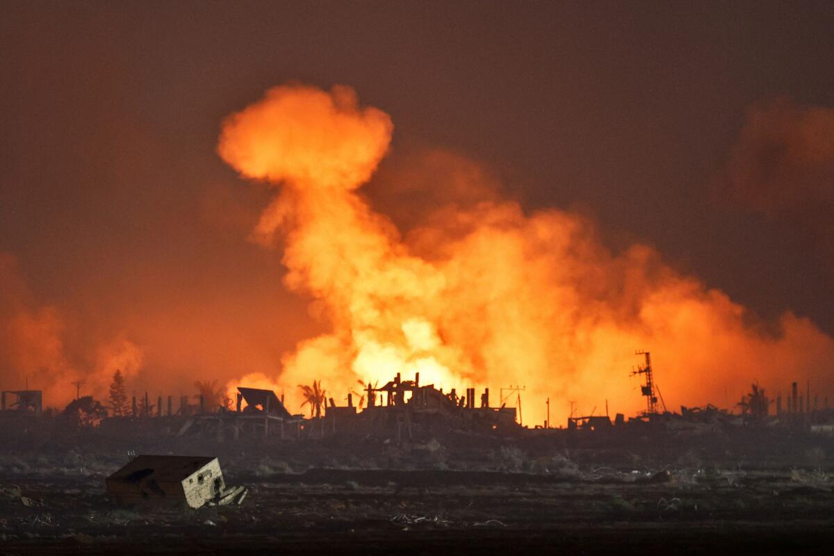 An explosion in Gaza is seen from the Israeli side of the Israel-Gaza border.