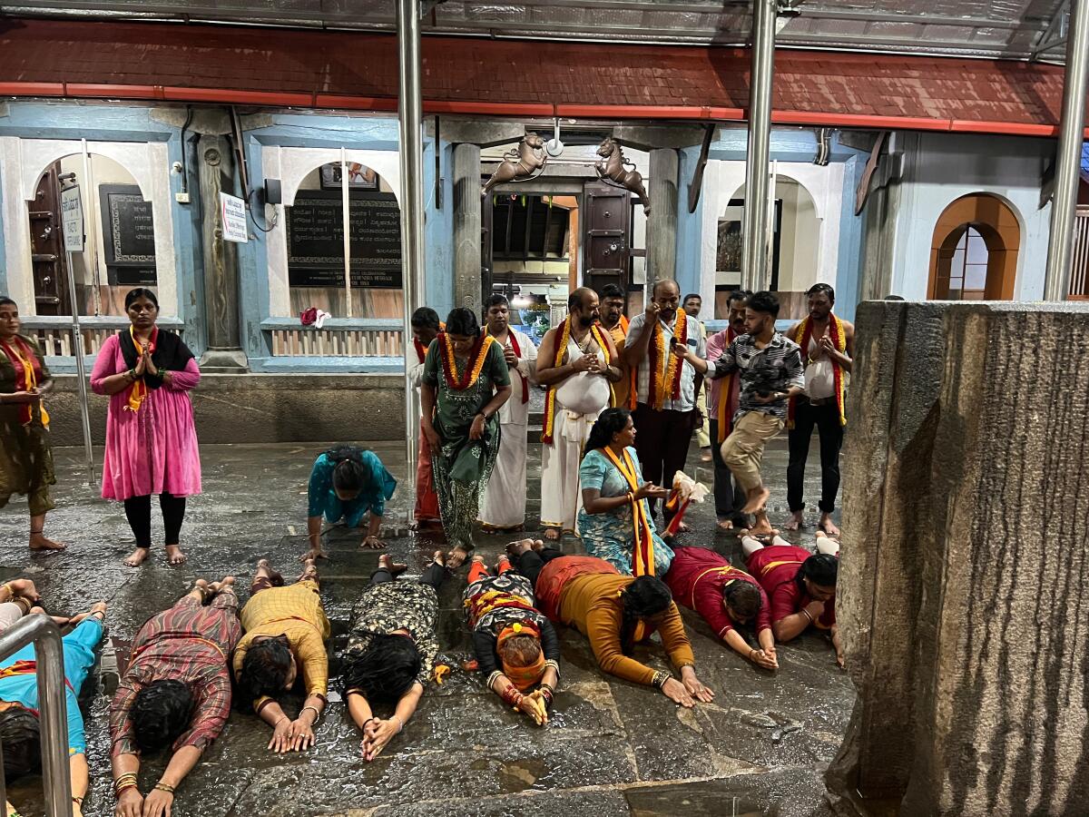 Members of Bengaluru based Kannadigara Rakshana Vedike performed `urulu seve' seeking an amicable end to disturbing messages on social media and mass media at Shri Manjunatha temple in Dharmasthala on Friday.