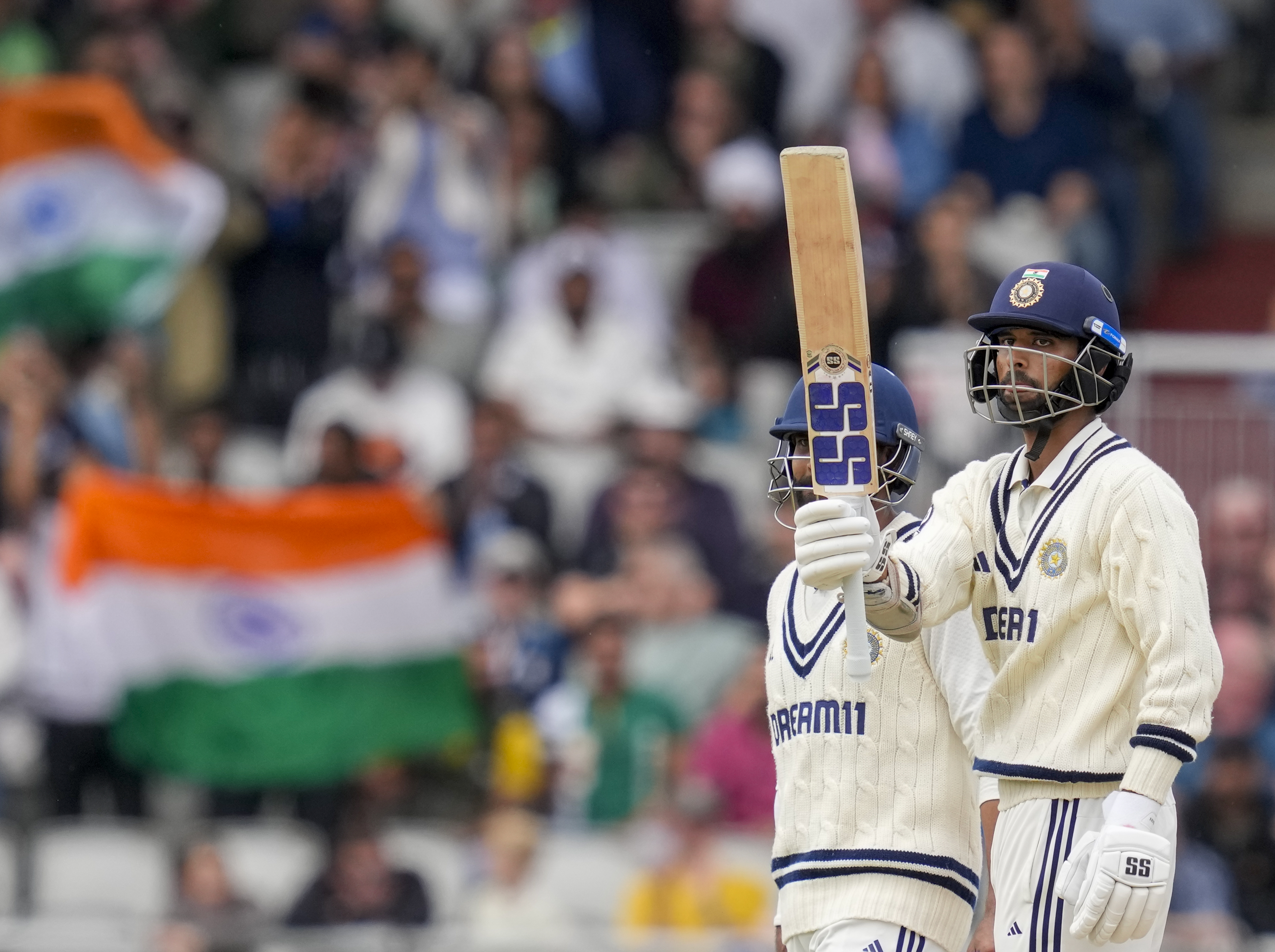 Ravindra Jadeja (left) brings out his sword celebration after his half-century while Washington Sundar acknowledges the crowd after completing his fifty. 