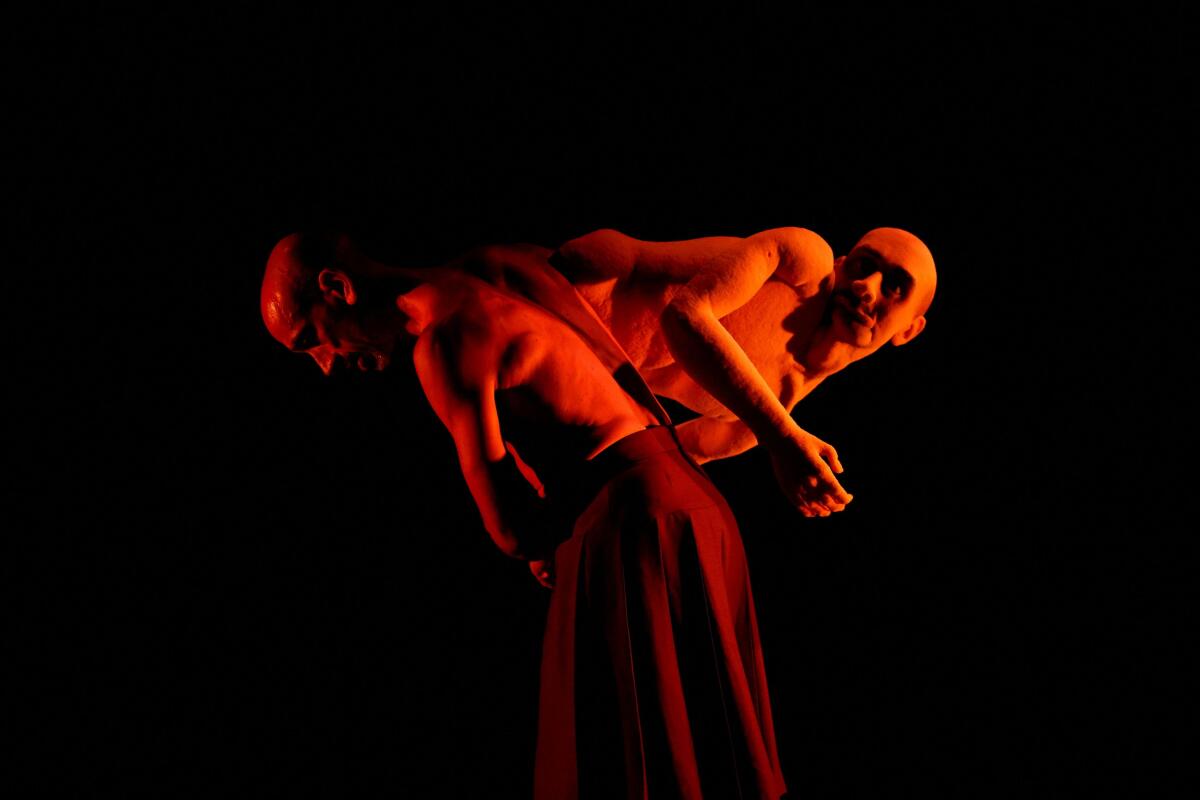 Dancer Thomas Noone performs with a puppet in "Usurper" during the Dance Festival Malta in Valletta, Malta