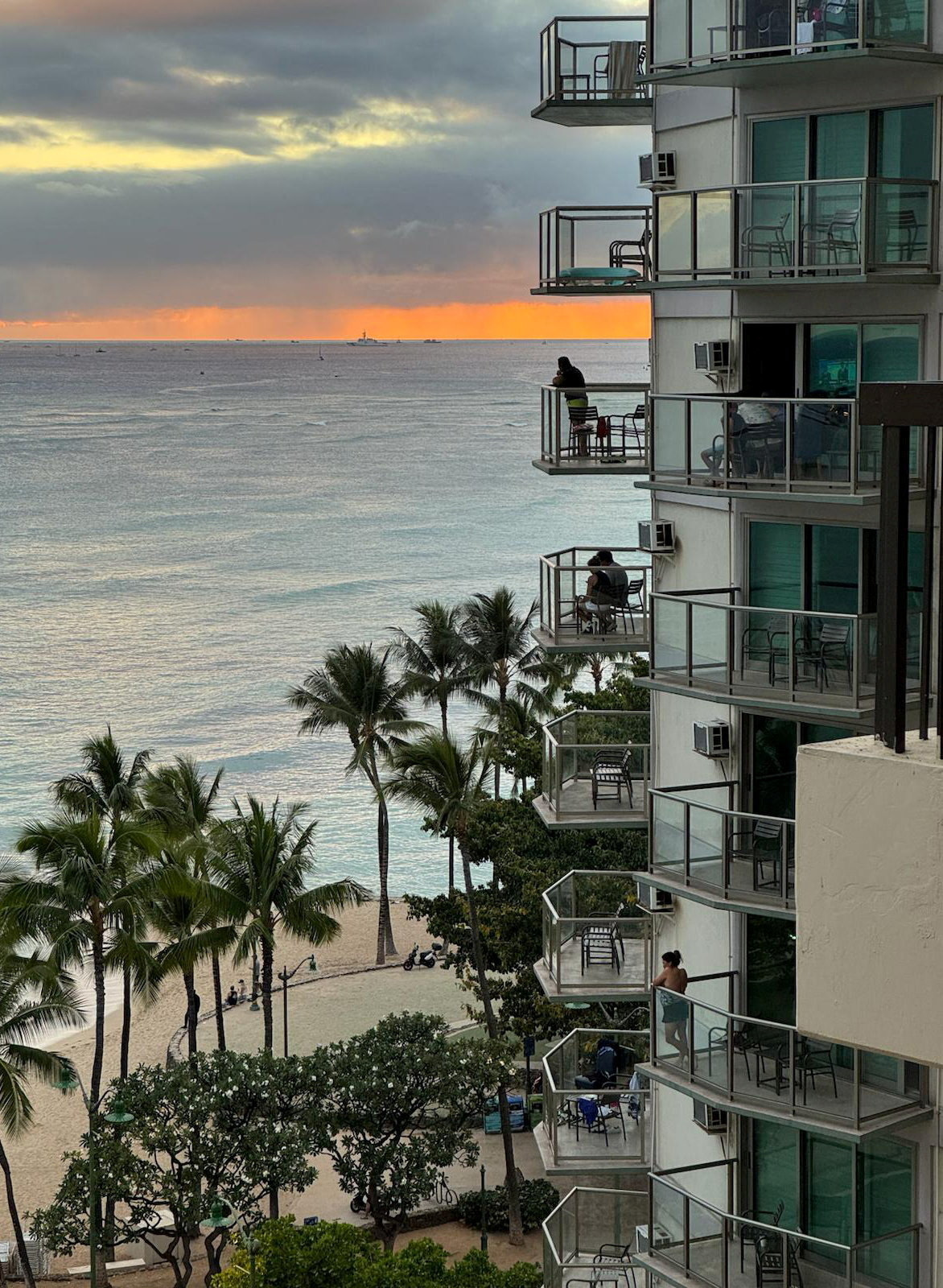 Vacationers stand on balconies at the Aston Waikiki Circle Hotel looking towards Waikiki Beach after authorities warned of tsunami waves, following an earthquake which earlier struck off Russia's Far Eastern Kamchatka Peninsula, in Honolulu, Hawaii, US July 29, 2025.