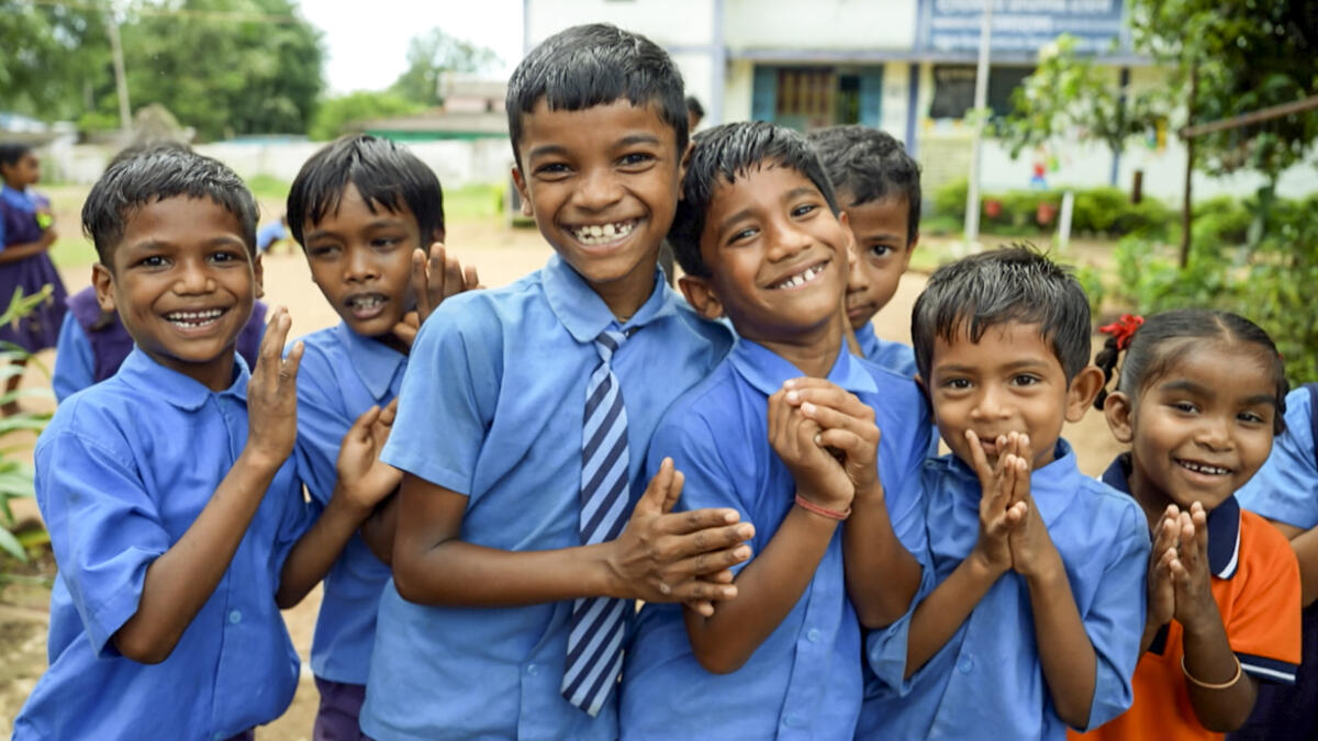 Students pose for pictures at a school, in Bastar, Chhattisgarh. Once trembling under the echoes of ‘Lal Salaam,’ Bastar now resonates with children’s laughter, school bells, and the sounds of progress.