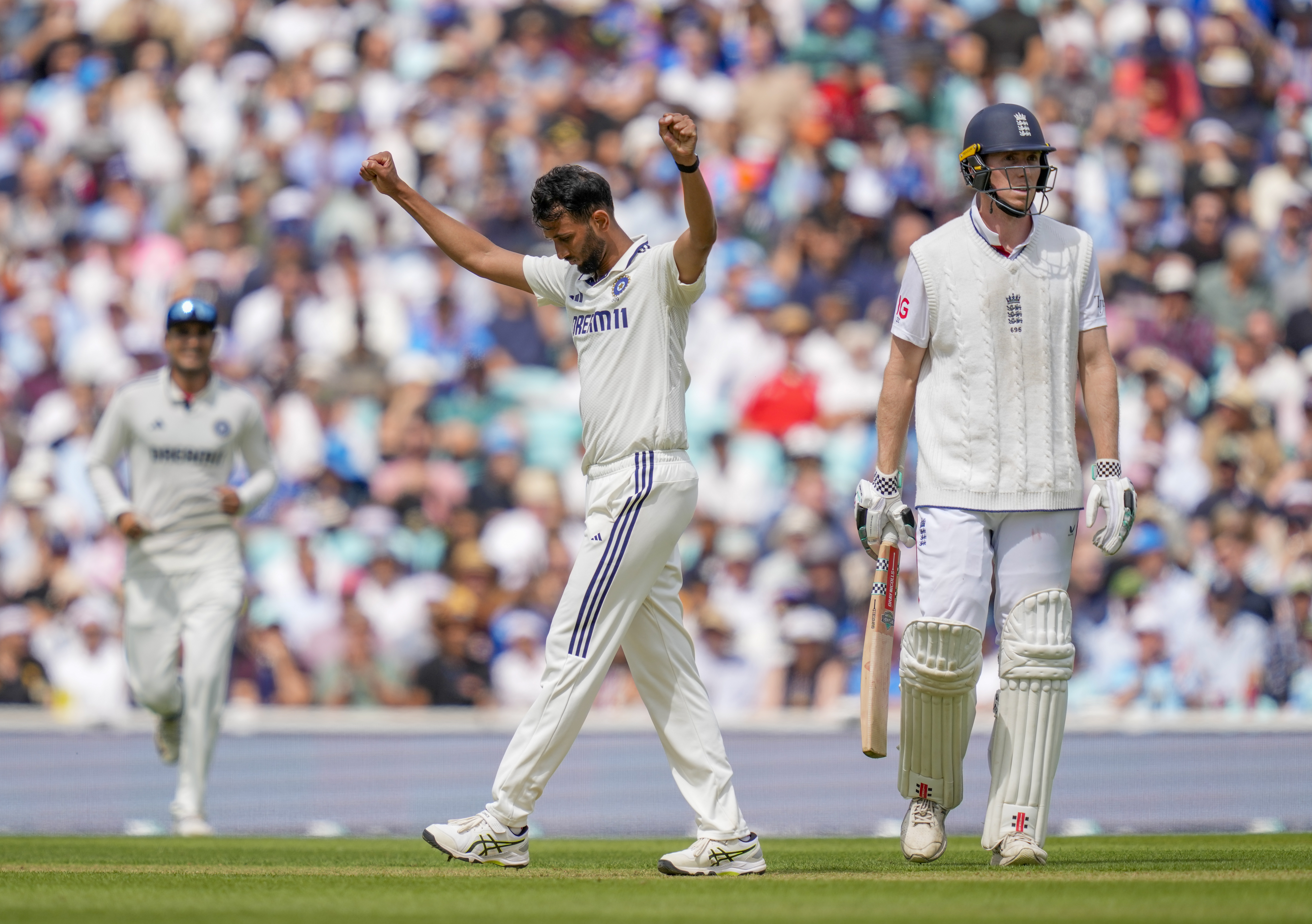 Prasidh Krishna (right) and Mohammed Siraj picked up four wickets apiece to bring India back into the encounter on the second day of the fifth Test on Friday. 