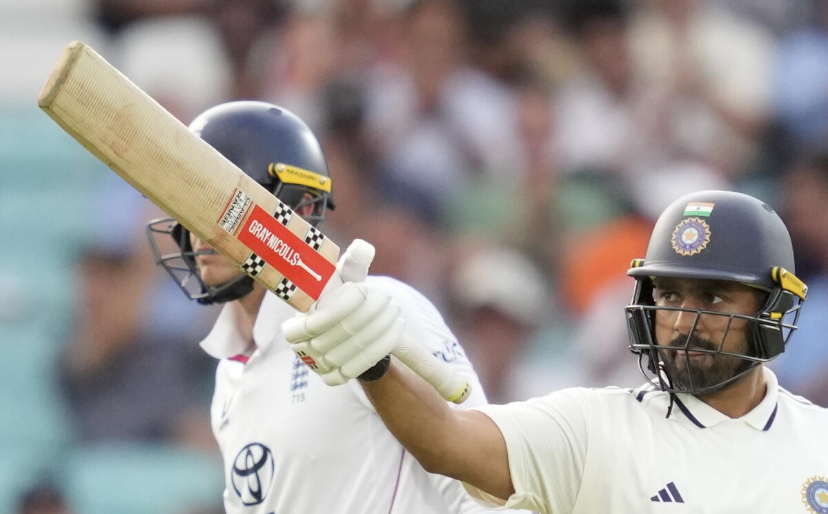 India's Karun Nair celebrates his half century during the first day of the fifth Test cricket match between India and England, at The Oval, in London, England, Thursday, July 31, 2025.