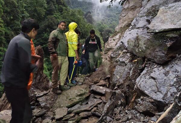 Rudraprayag: NDRF and Uttarakhand SDRF personnel rescue people stranded after the pedestrian path to Kedarnath Dham was blocked by debris falling from the hill above, in Rudraprayag district, Uttarakhand.