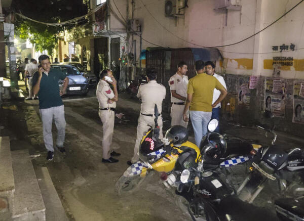 New Delhi: Police personnel conduct investigation after a 28-year-old man was allegedly shot at by three bike-borne assailants, in Delhi's Mohan Garden area, Monday, Aug. 4, 2025. Police sources said that the shooting took place due to an ongoing tussle between the Nandu Gang and the Himanshu Bhau gang.