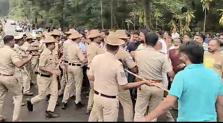 Police dispersing the crowd at Dharmasthala village. 