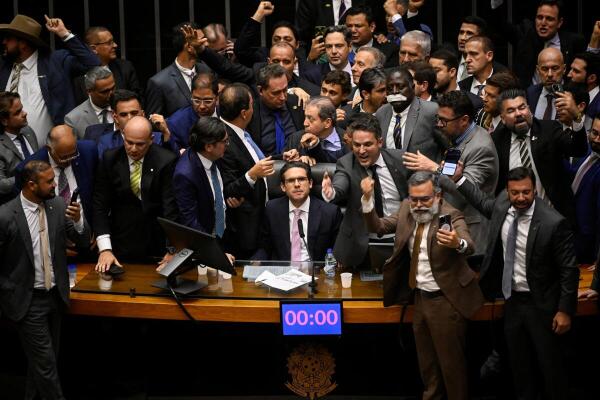 President of the Chamber of Deputies Hugo Motta sits in his chair after the end of a protest by allies of former president Jair Bolsonaro that blocked the resumption of sessions after the mid-year recess in protest against the house arrest of Bolsonaro, at the Chamber of Deputies in Brasilia, Brazil.