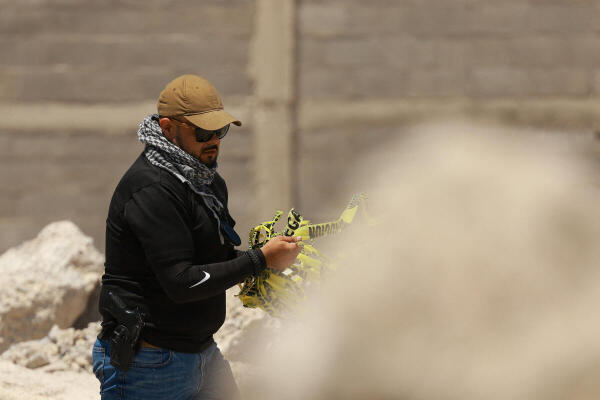 An investigative officer from the Chihuahua State Attorney General’s Office works at a crematorium where bodies were previously found piled up in unsanitary conditions, in Ciudad Juarez.