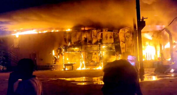 Smoke and flames billow out after a fire broke out at a cold storage, in Siddipet, Karnataka, Wednesday.