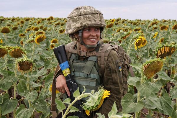 A servicewoman of the 65th Separate Mechanized Brigade of the Ukrainian Armed Forces attends a military drill as recruits near a frontline, amid Russia's attack on Ukraine, in Zaporizhzhia region, Ukraine.