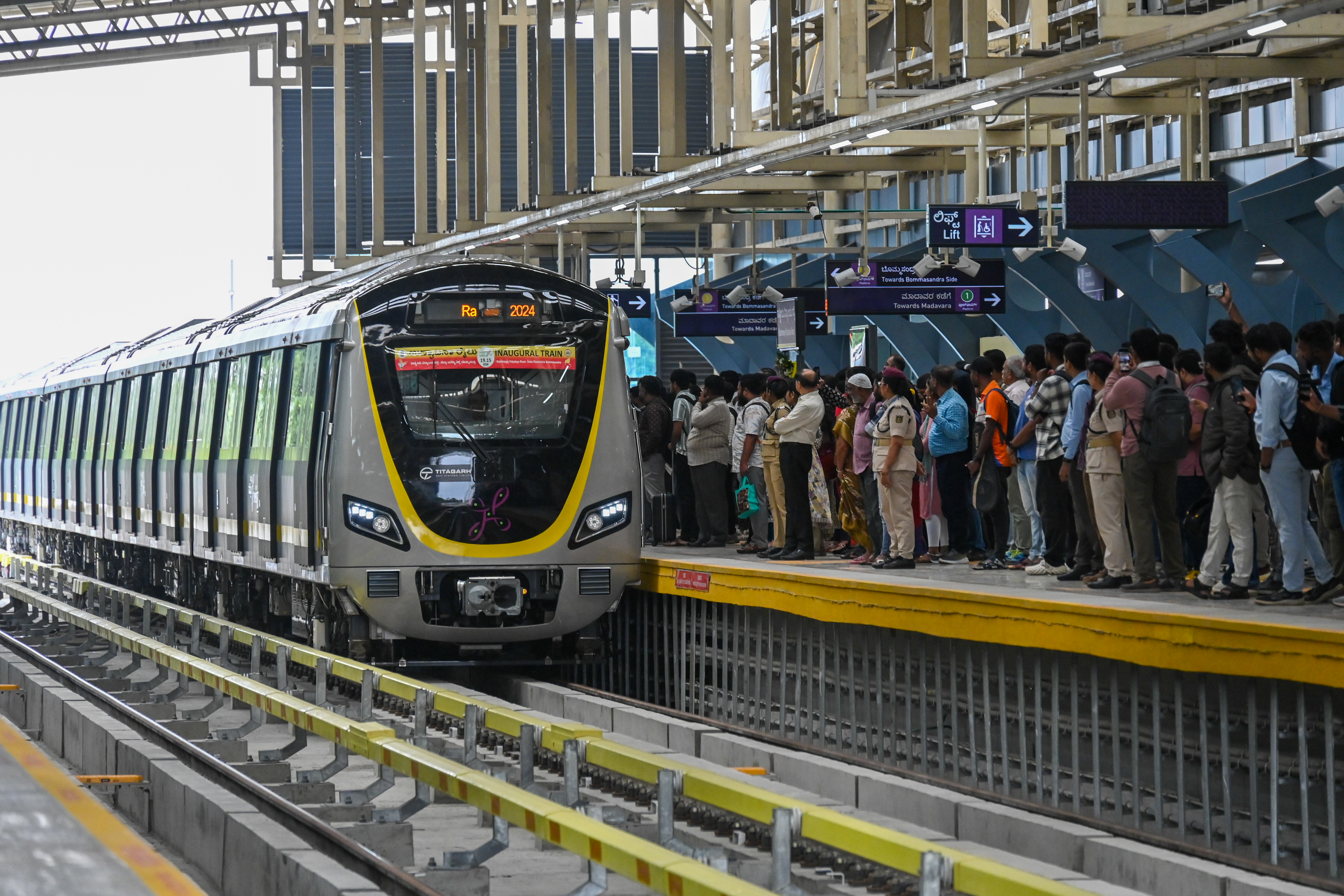 Metro commuters on the first day of commercial service of Namma Metro