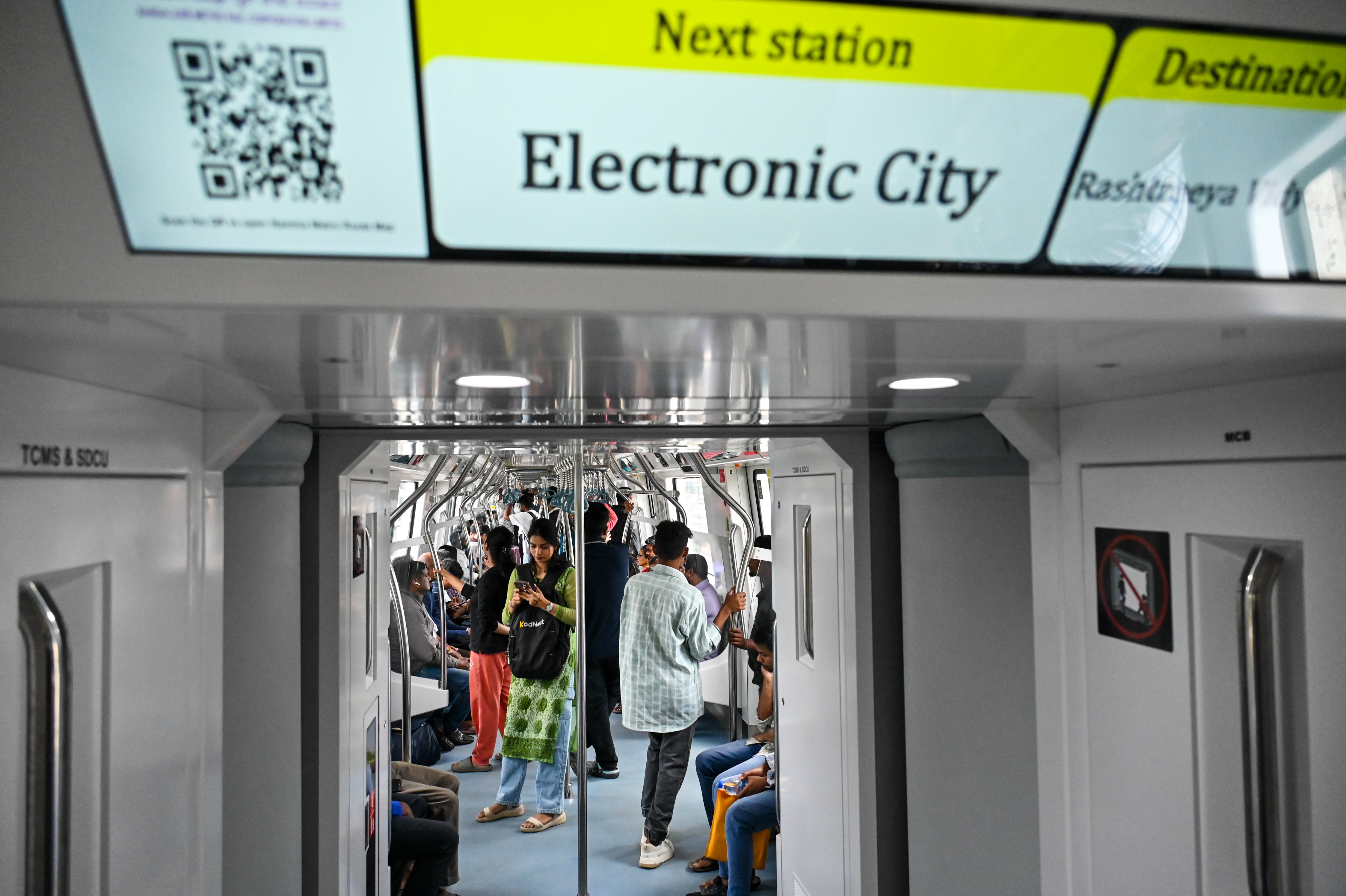 Metro commuters on the first day of commercial service of Namma Metro