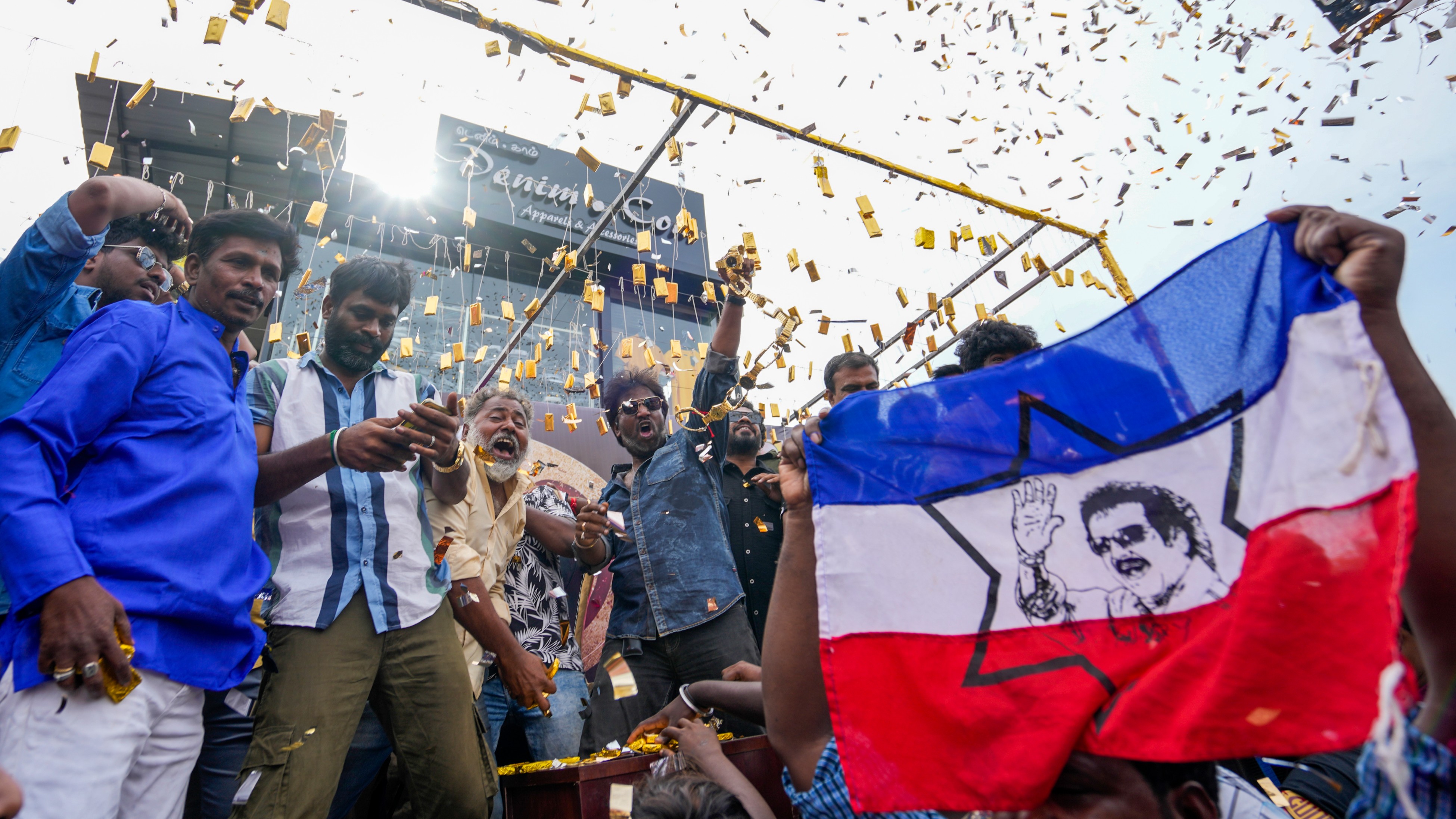 Rajinikanth fans gather outside a Chennai theater to celebrate the release of his latest film, Coolie.