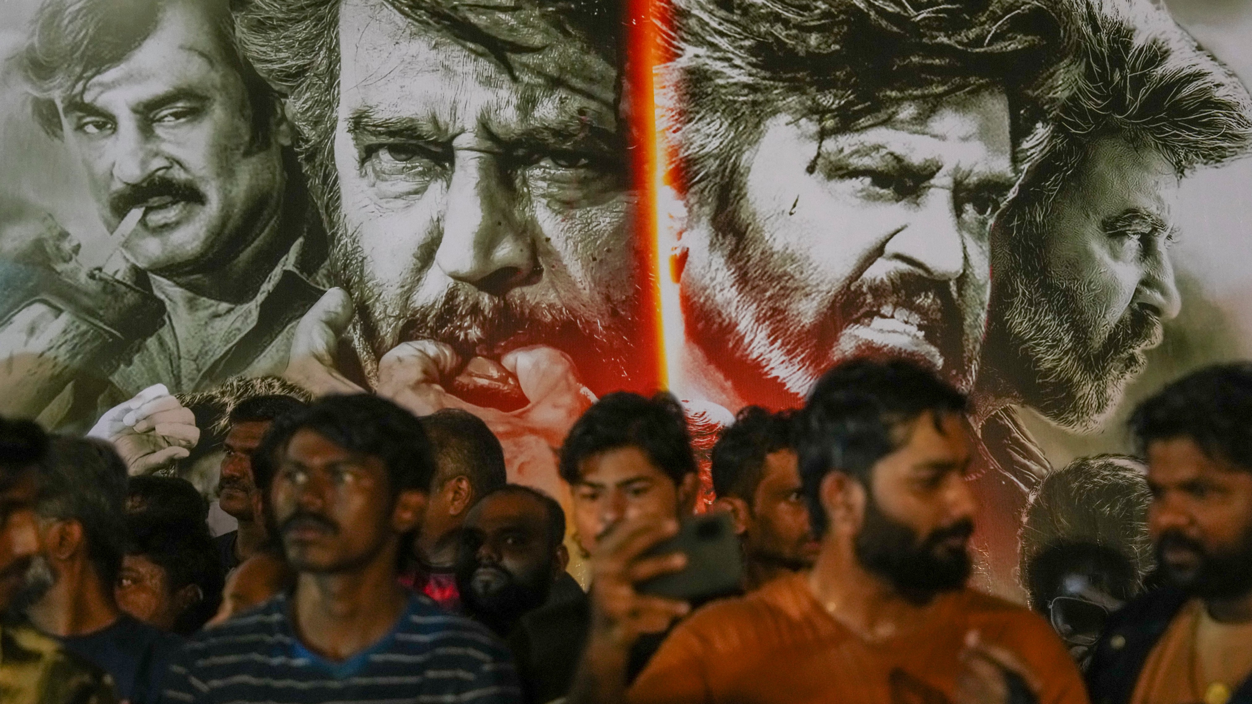 Fans of superstar Rajinikanth gather to watch the first day first show of Coolie at a theater in Mumbai.